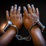 Close-up Of human hand with Indian handcuffs