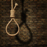 suicide concept. noose with shadow on dark wall background