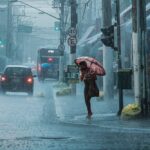 free-photo-of-people-walking-in-heavy-rain-in-city