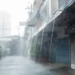 heavy-rain-town-home-waterfall-roof-129962712
