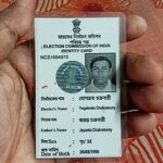 An_Indian_holding_a_Voter_Identity_Card,_photo_taken_by_Yogabrata_Chakraborty,_on_July_9,_2023