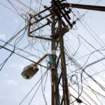 electric-pole-with-power-supply-wires-chaos-cochin-now-kochi-kerala-FG1E4D