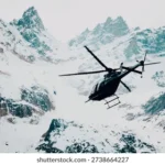black-helicopter-flying-over-snowcovered-260nw-2738664227